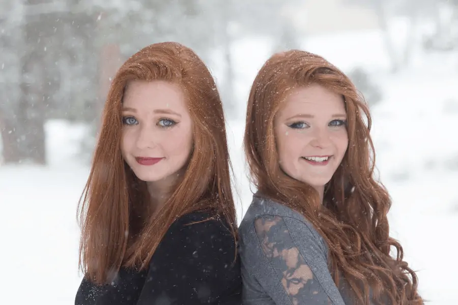 2 Sisters Standing In The Snow