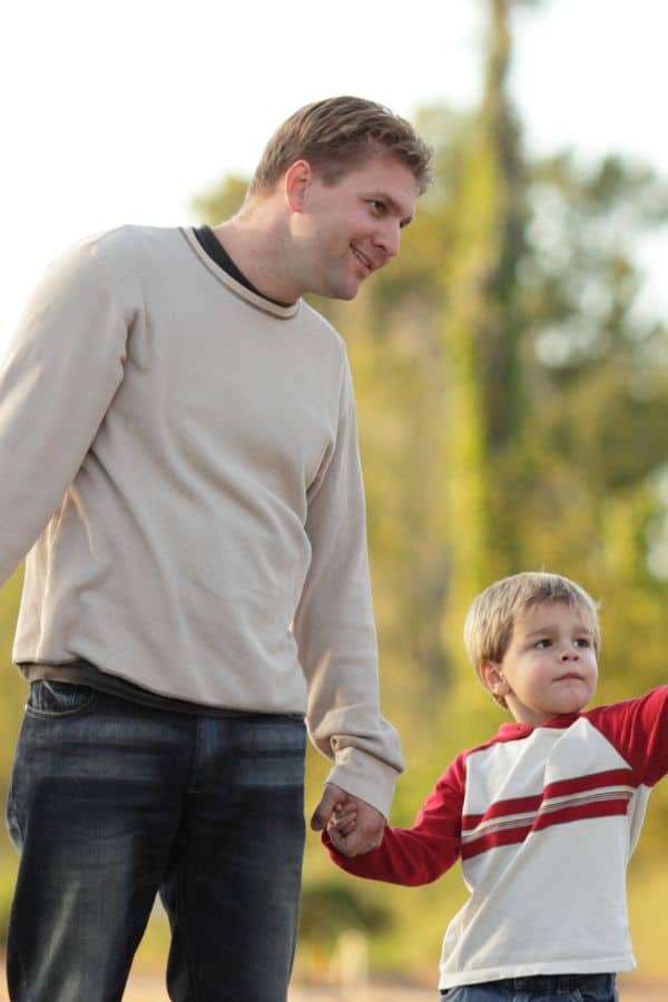 Father holding son hand - Grief Poem for loss of a father
